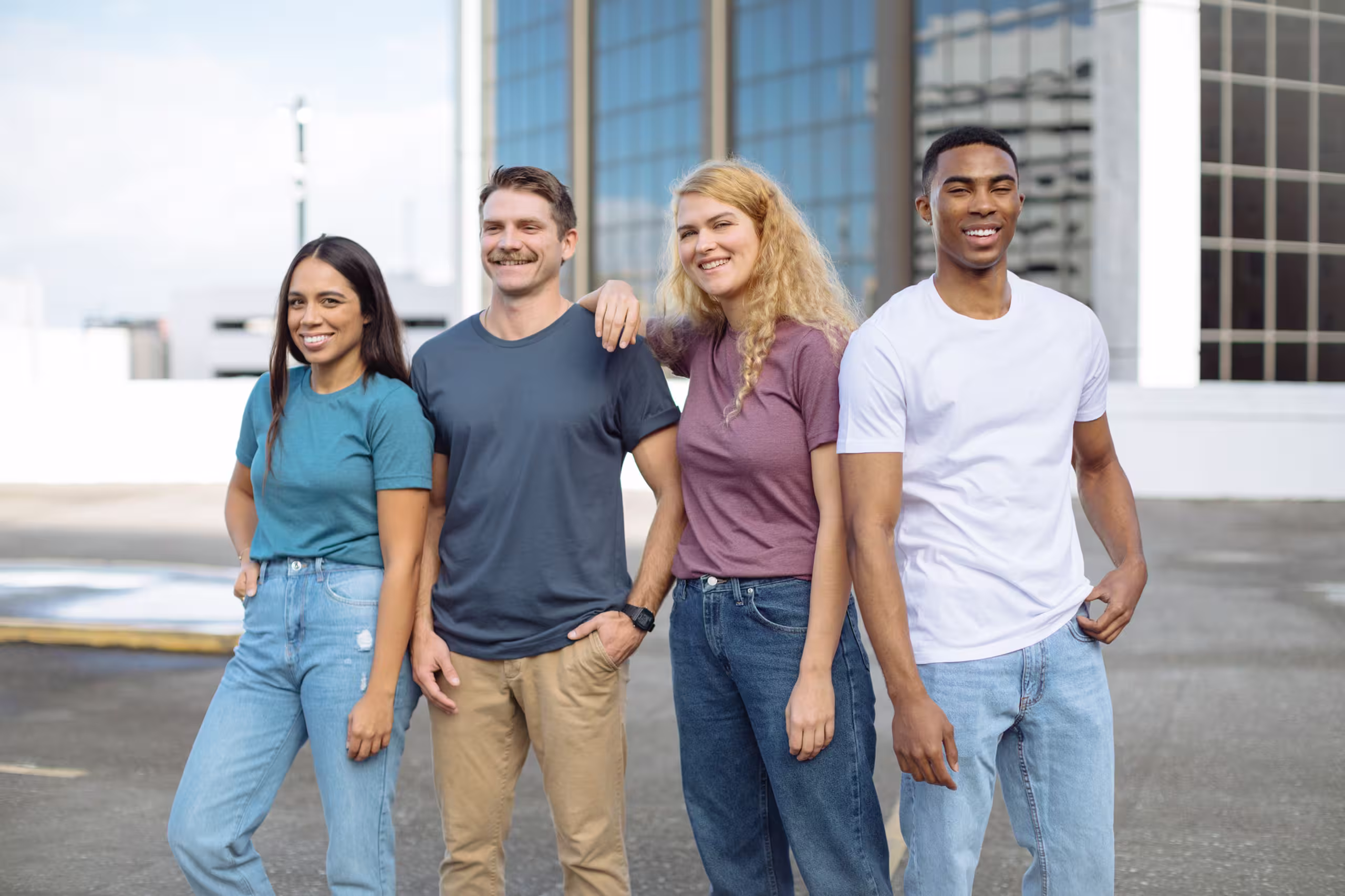 Four people posing for an image.