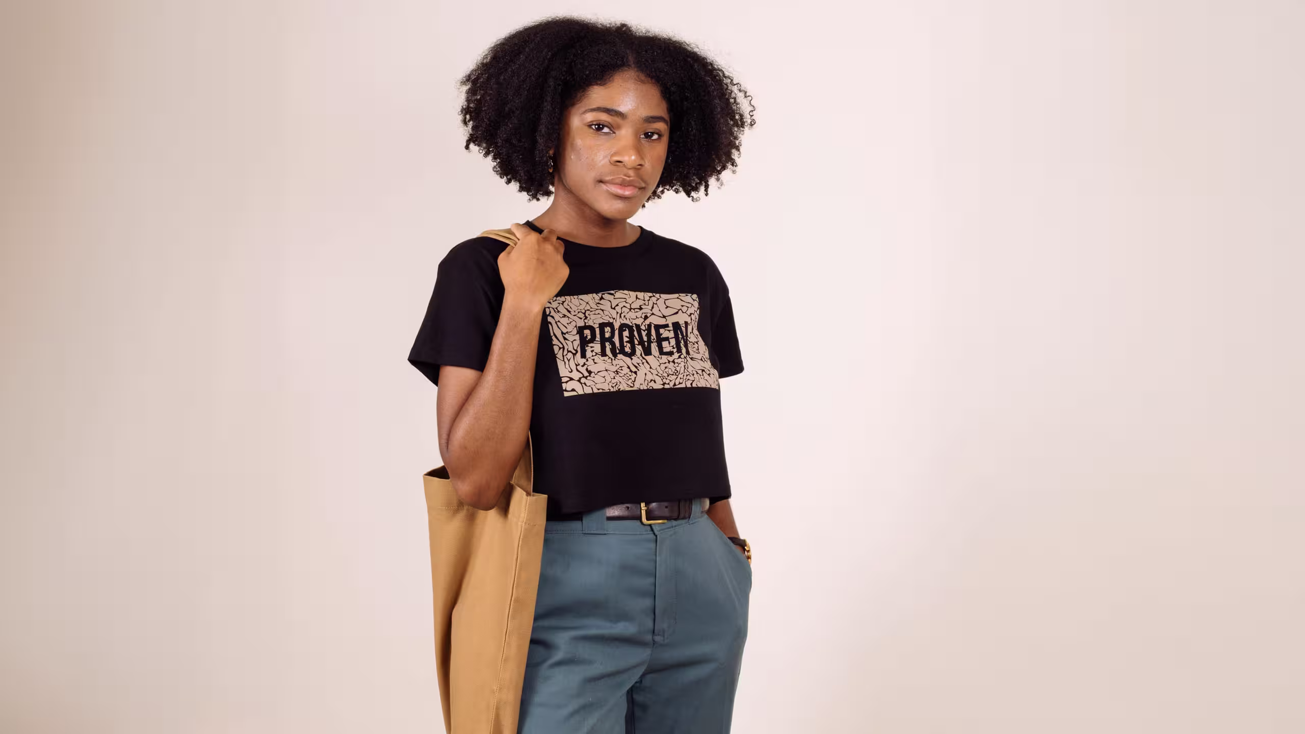 women wearing a black shirt holding a yellow bag
