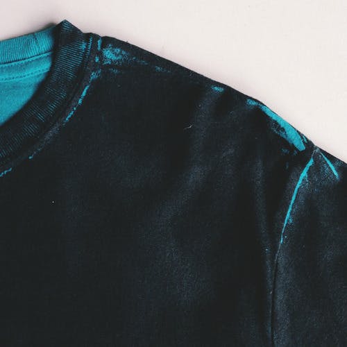 teal shirt with black all over it teal shirt with black all over it