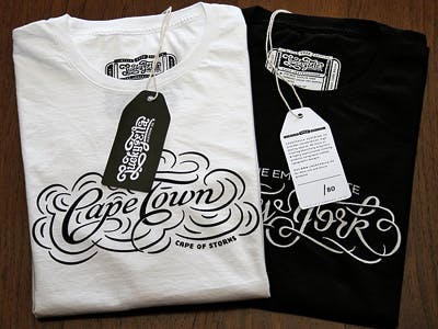 white and black shirts folded with cape town printed on them white and black shirts folded with cape town printed on them