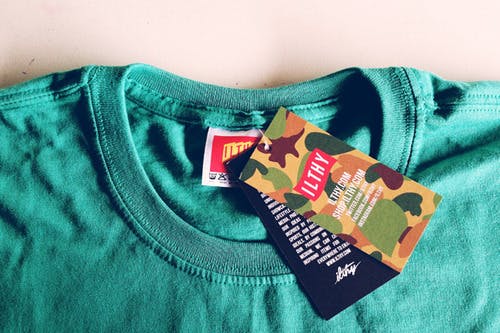 hang tags on green t-shirt hang tags on green t-shirt