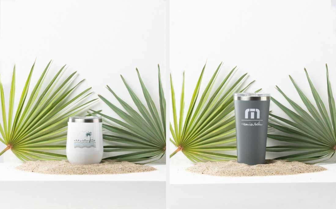 two thermoses in front of palm branches two thermoses in front of palm branches