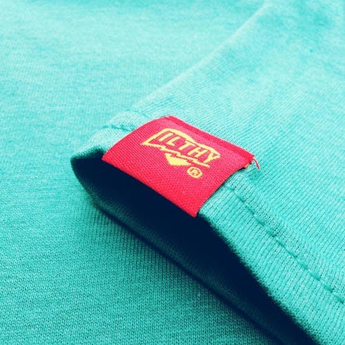 hem tag on green t-shirt hem tag on green t-shirt