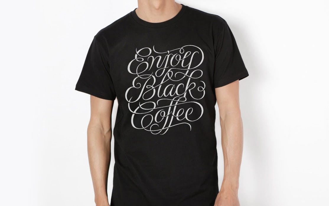 black t0shirt with enjoy black coffee in calligraphy font printed on it black t0shirt with enjoy black coffee in calligraphy font printed on it