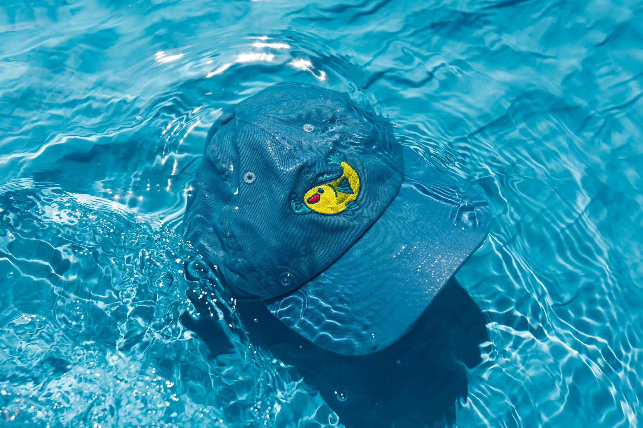 hat floating in water hat floating in water